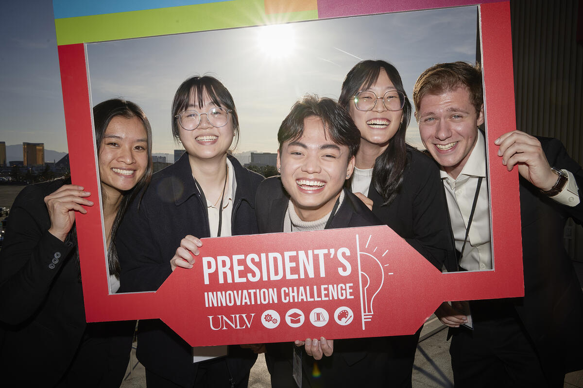 Five people looking out of a frame that says &quot;President's Innovation Challenge UNLV&quot;