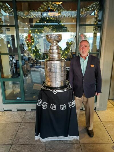 David Randel stands with the Stanley Cup.