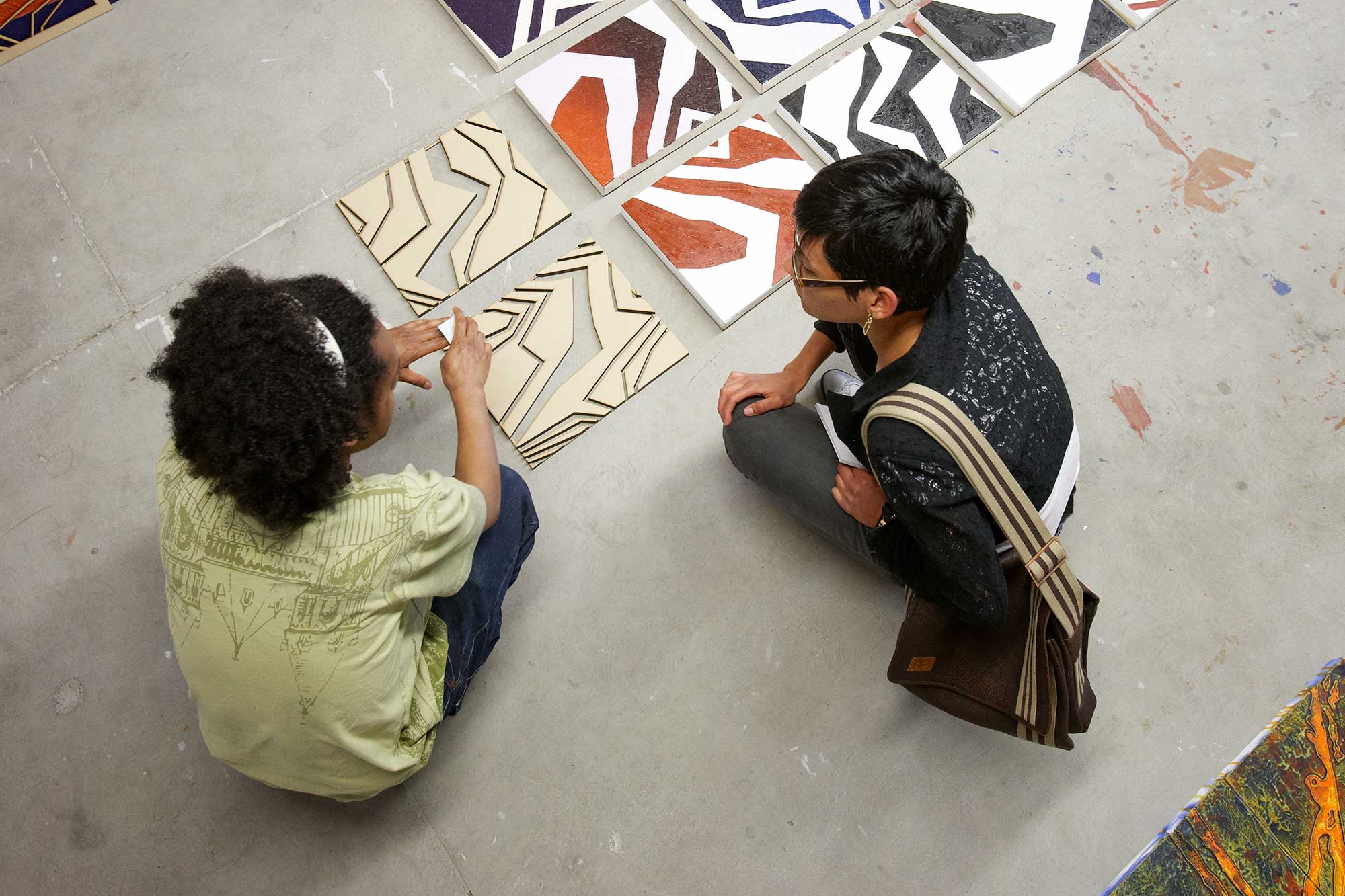 Two children play with textiles