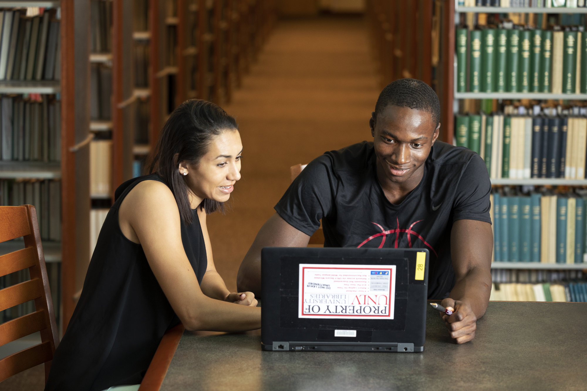 Two students study together