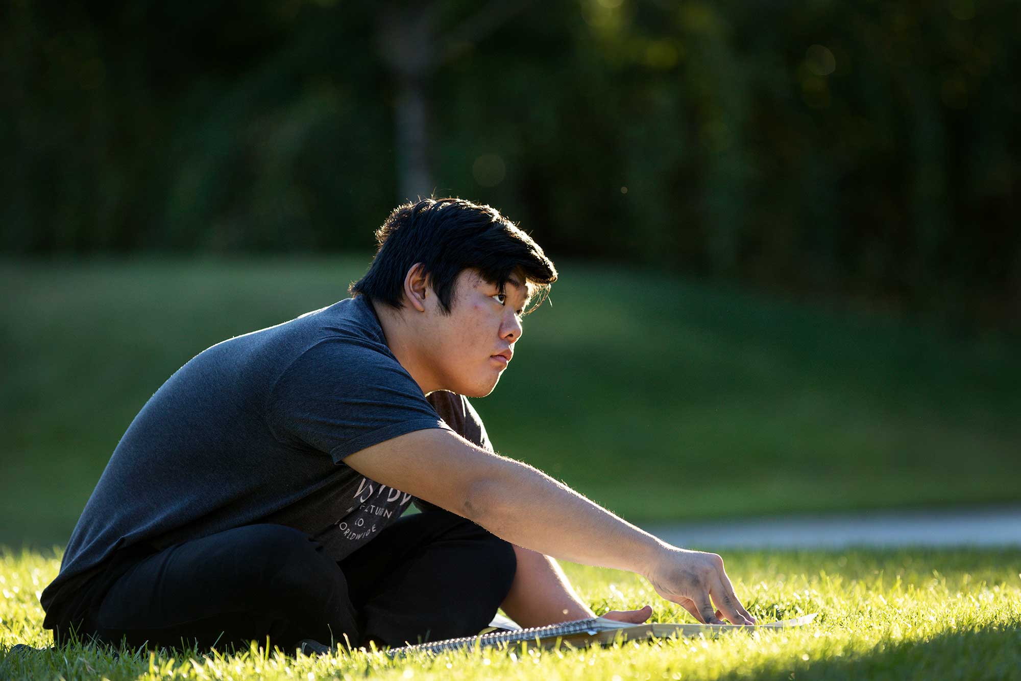 Student begins drawing while observing the scenery around them