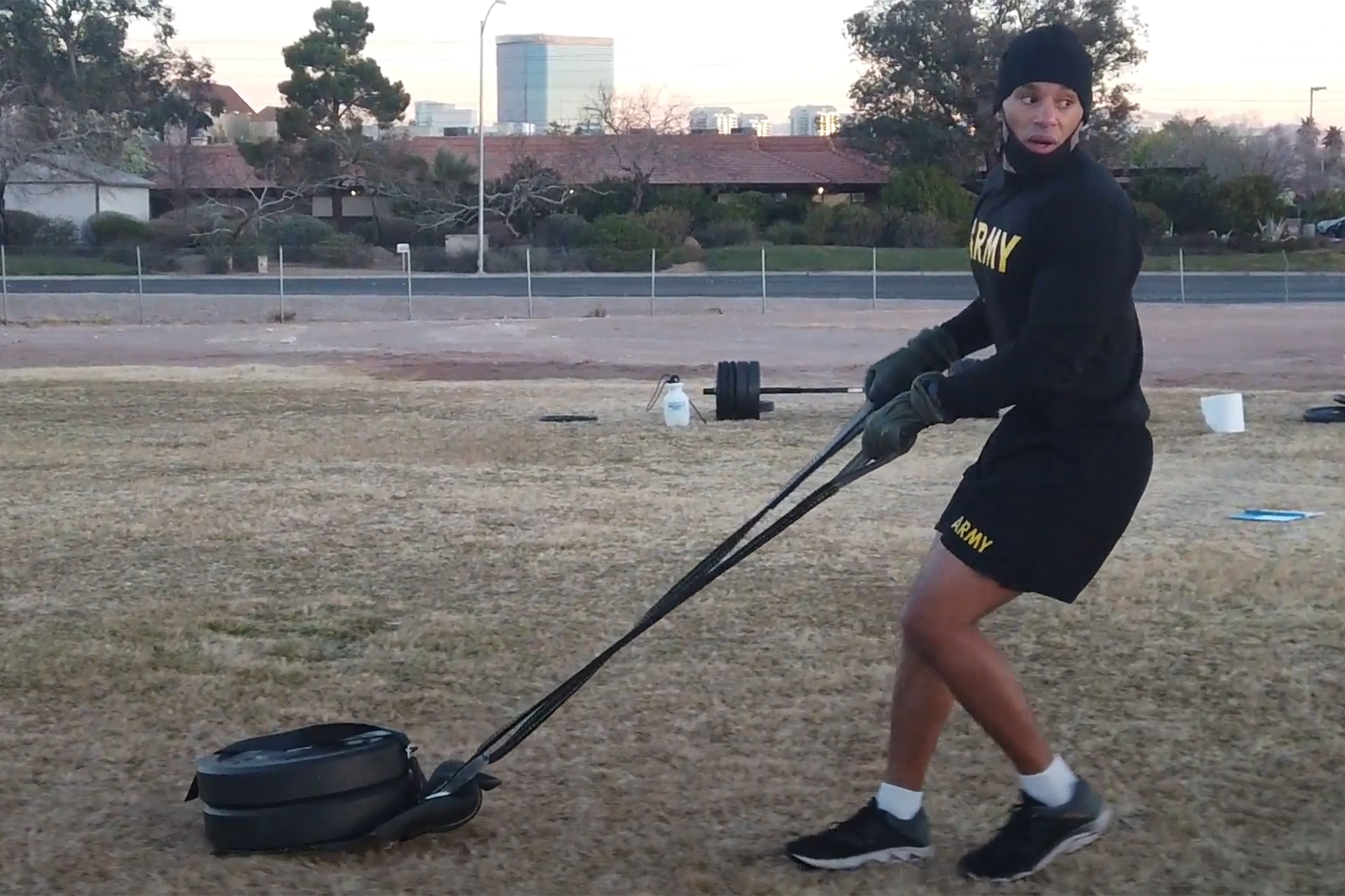 Man dragging tire