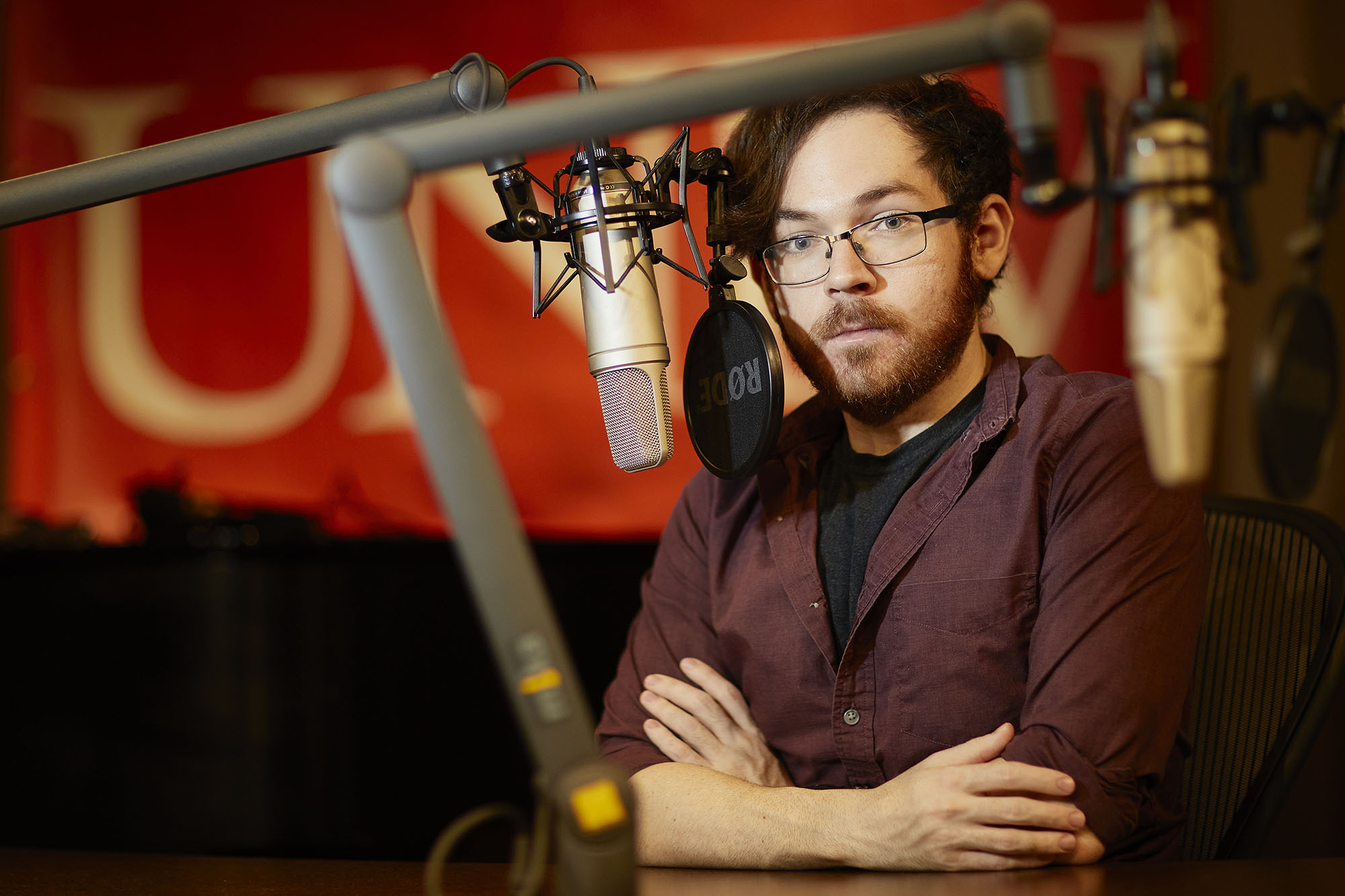 A man inside of a radio studio.