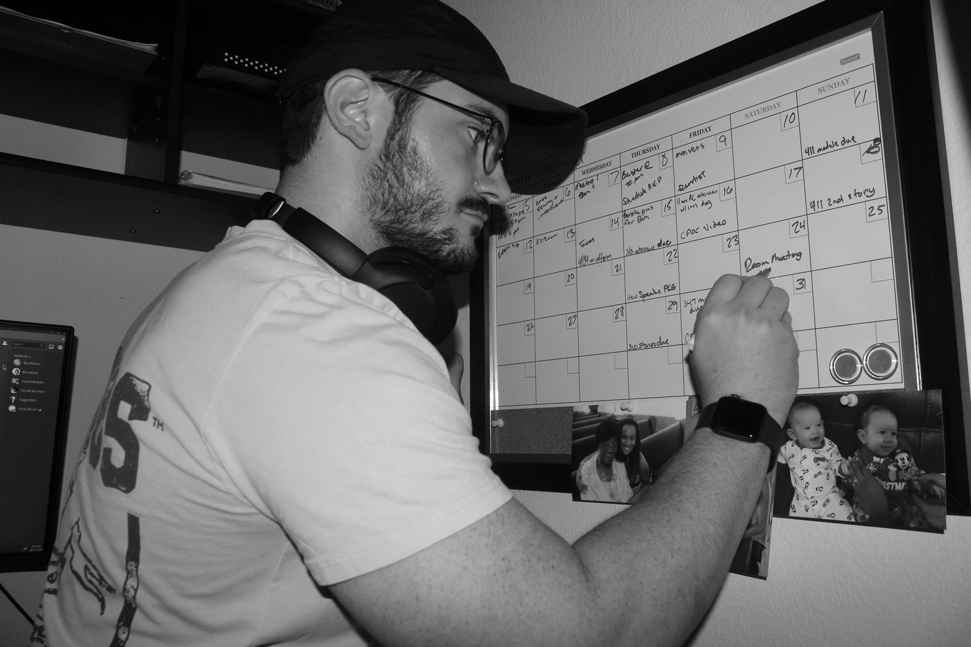 A man writing on a whiteboard.