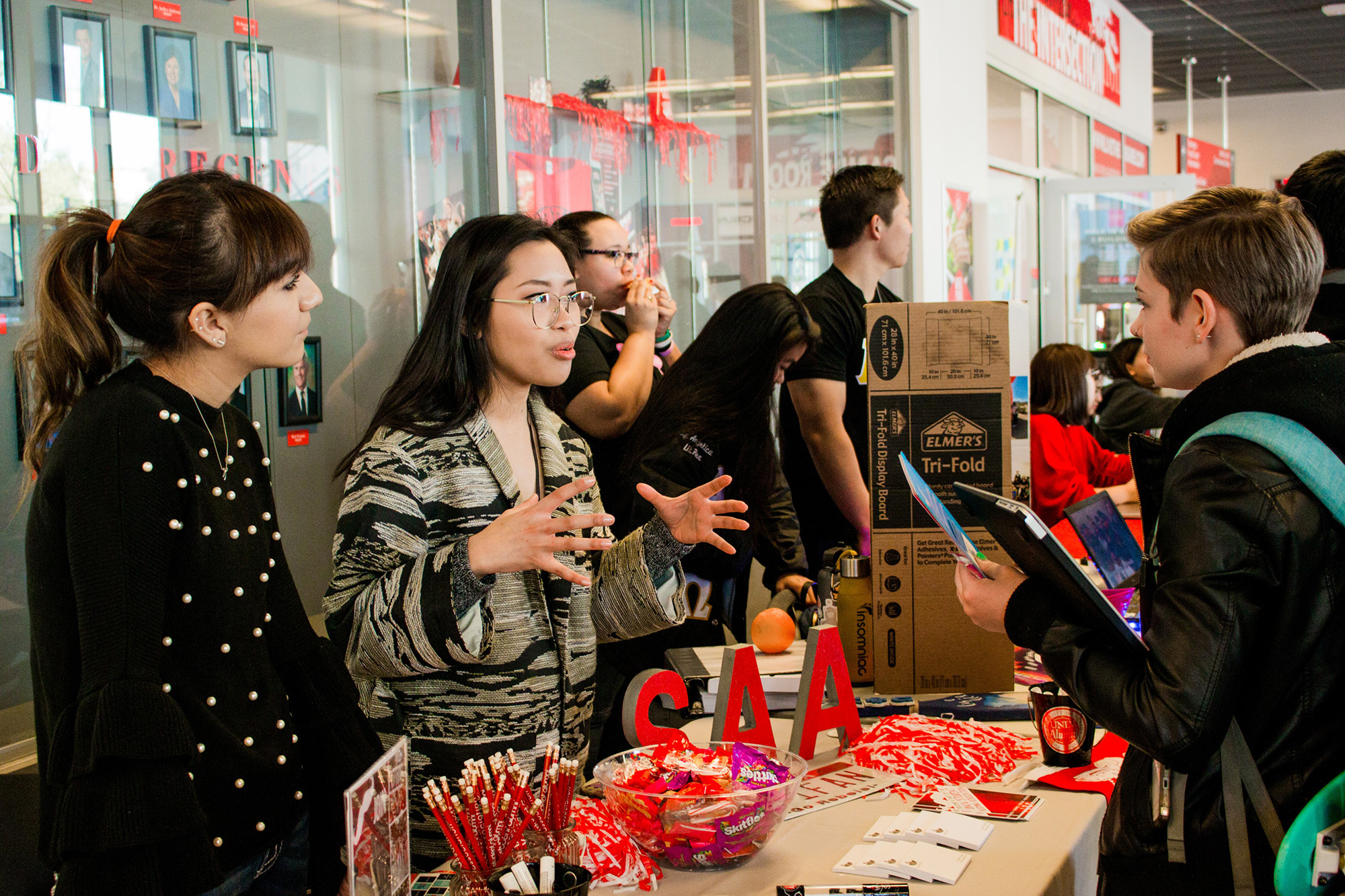 Students gathering around about an event