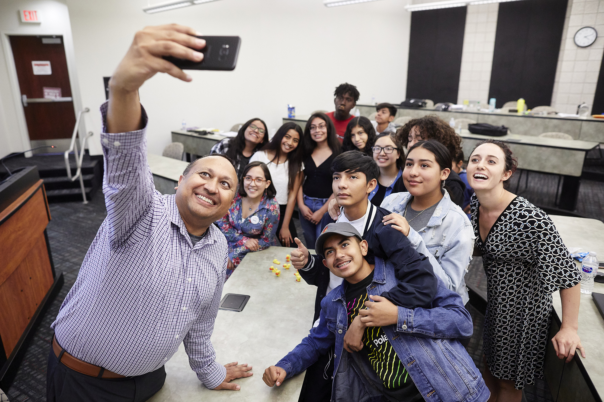 Group of people taking a selfie group picture