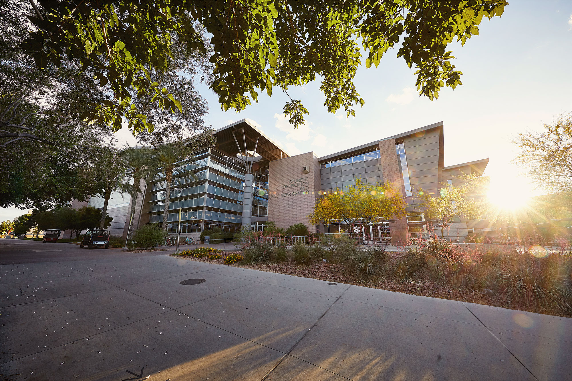 A landscape photo of the front exterior of the Student Recreation and Wellness Center