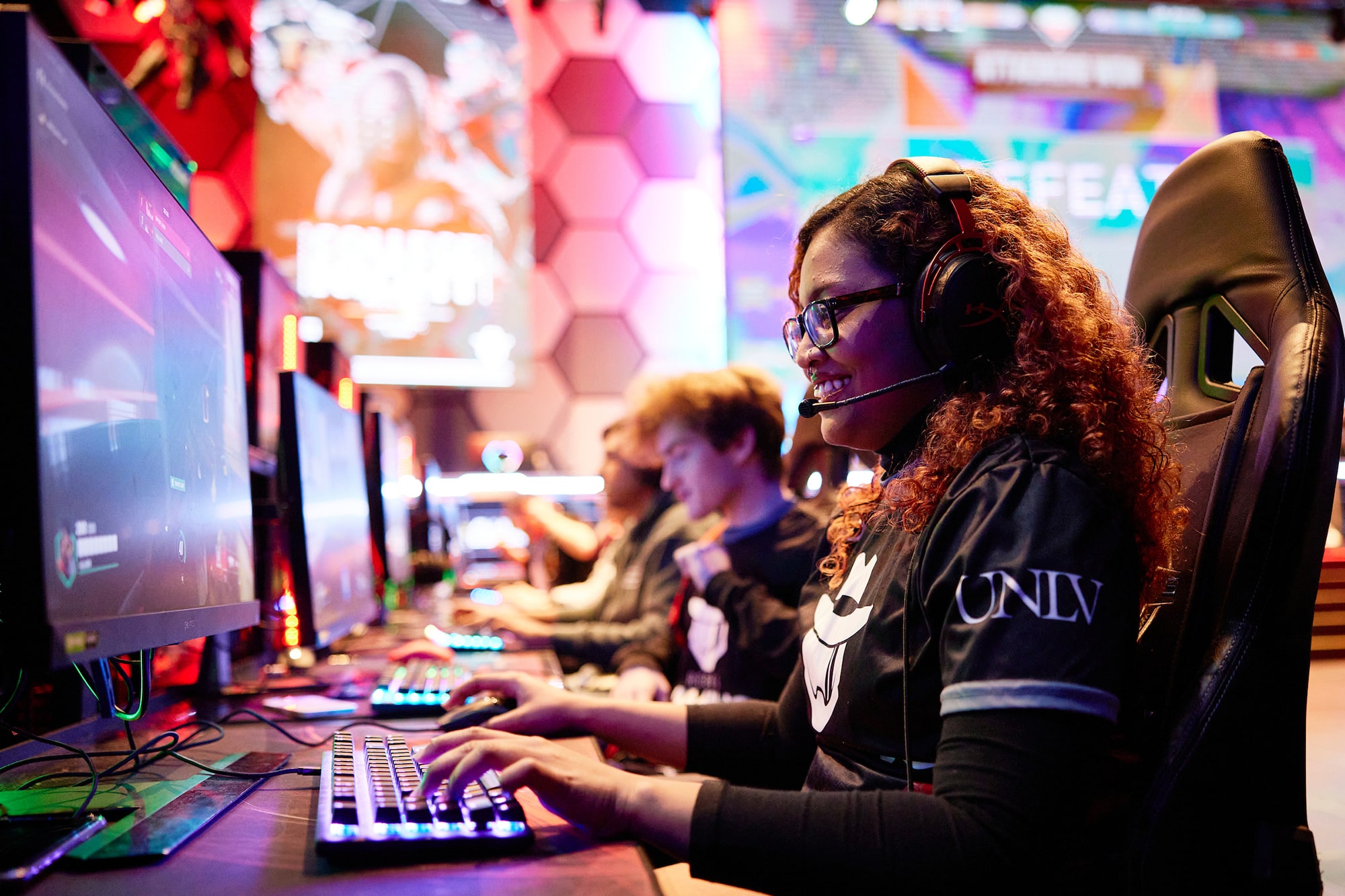 Students sitting at computers participating in e-sports