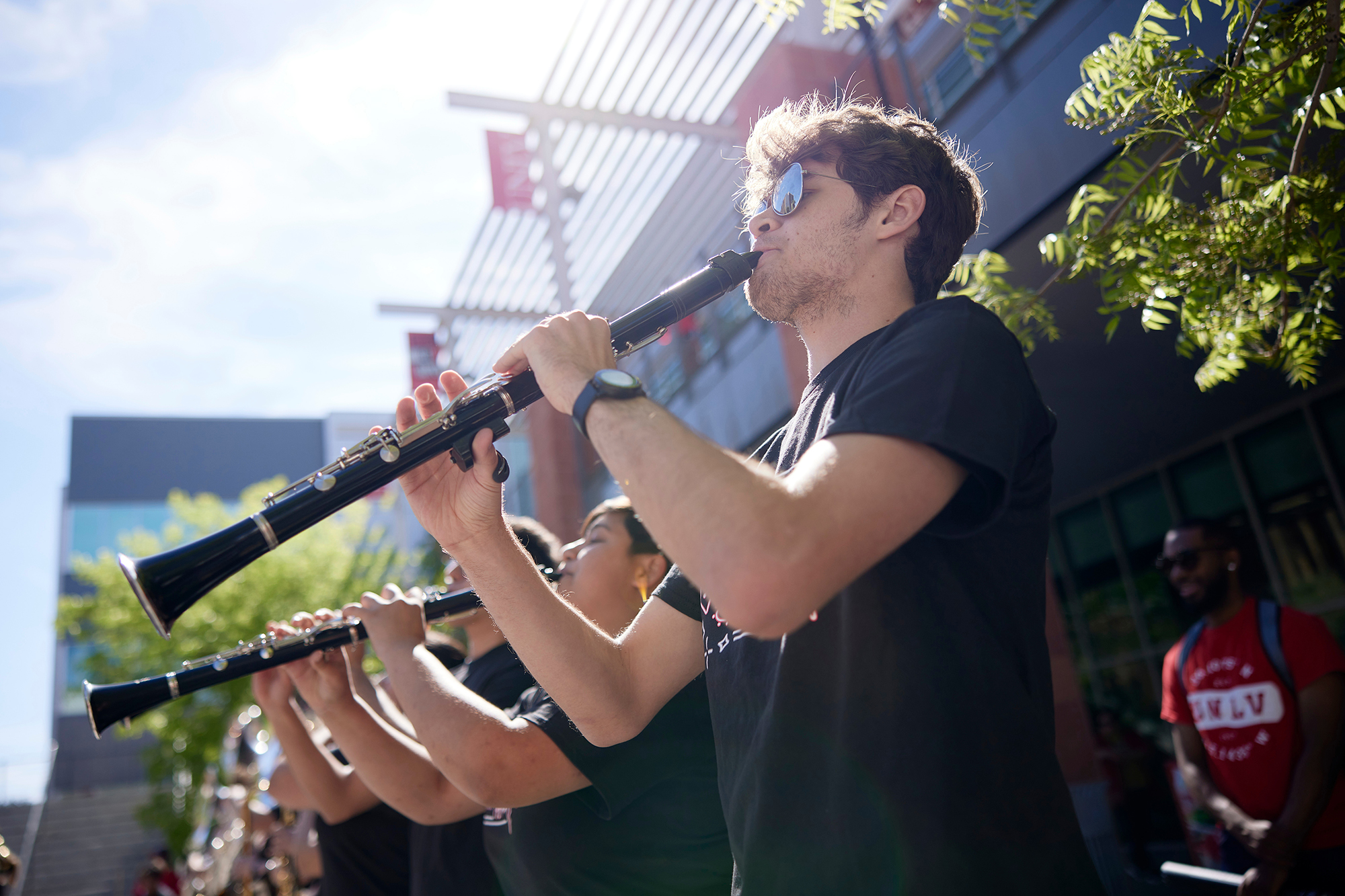 Line of UNLV band students playing oboe