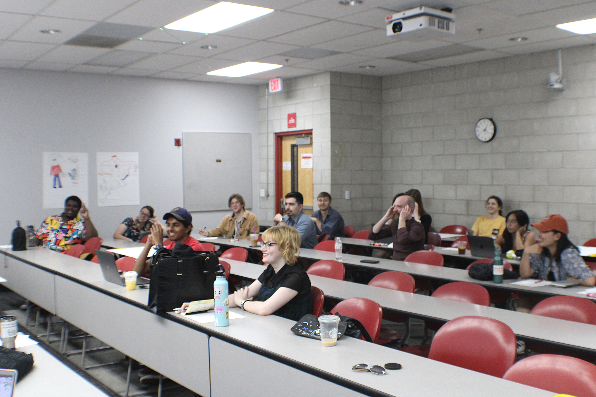 students sitting in rows and listening to class lecture