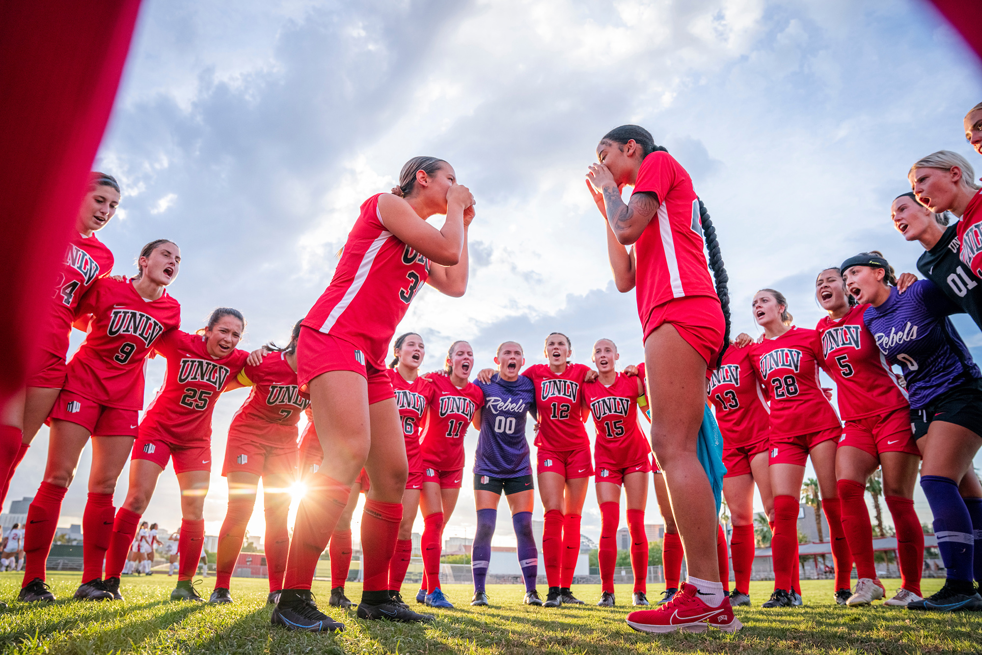 group of people in red soccer uniforms