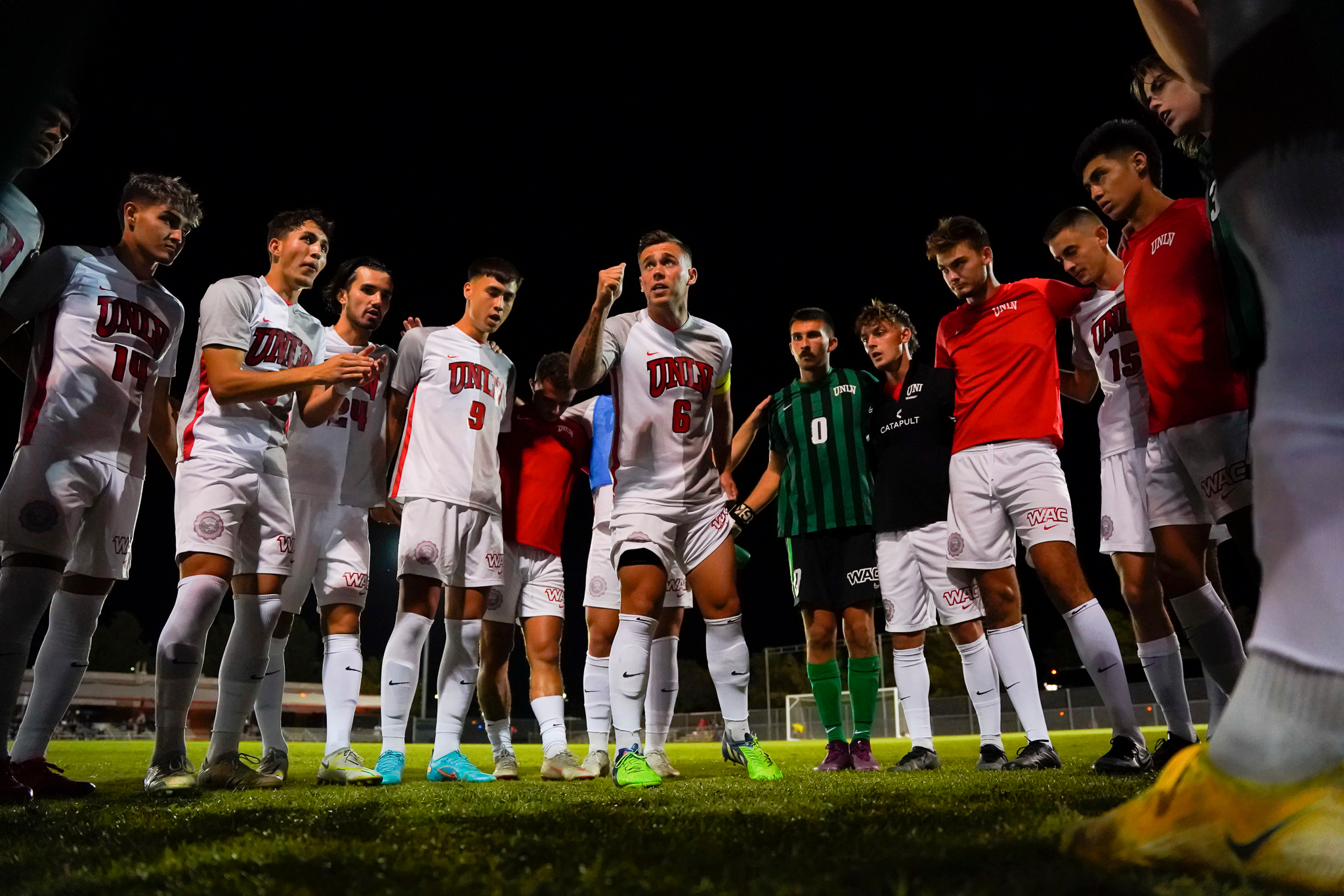 UNLV men's soccer team during a team huddle.