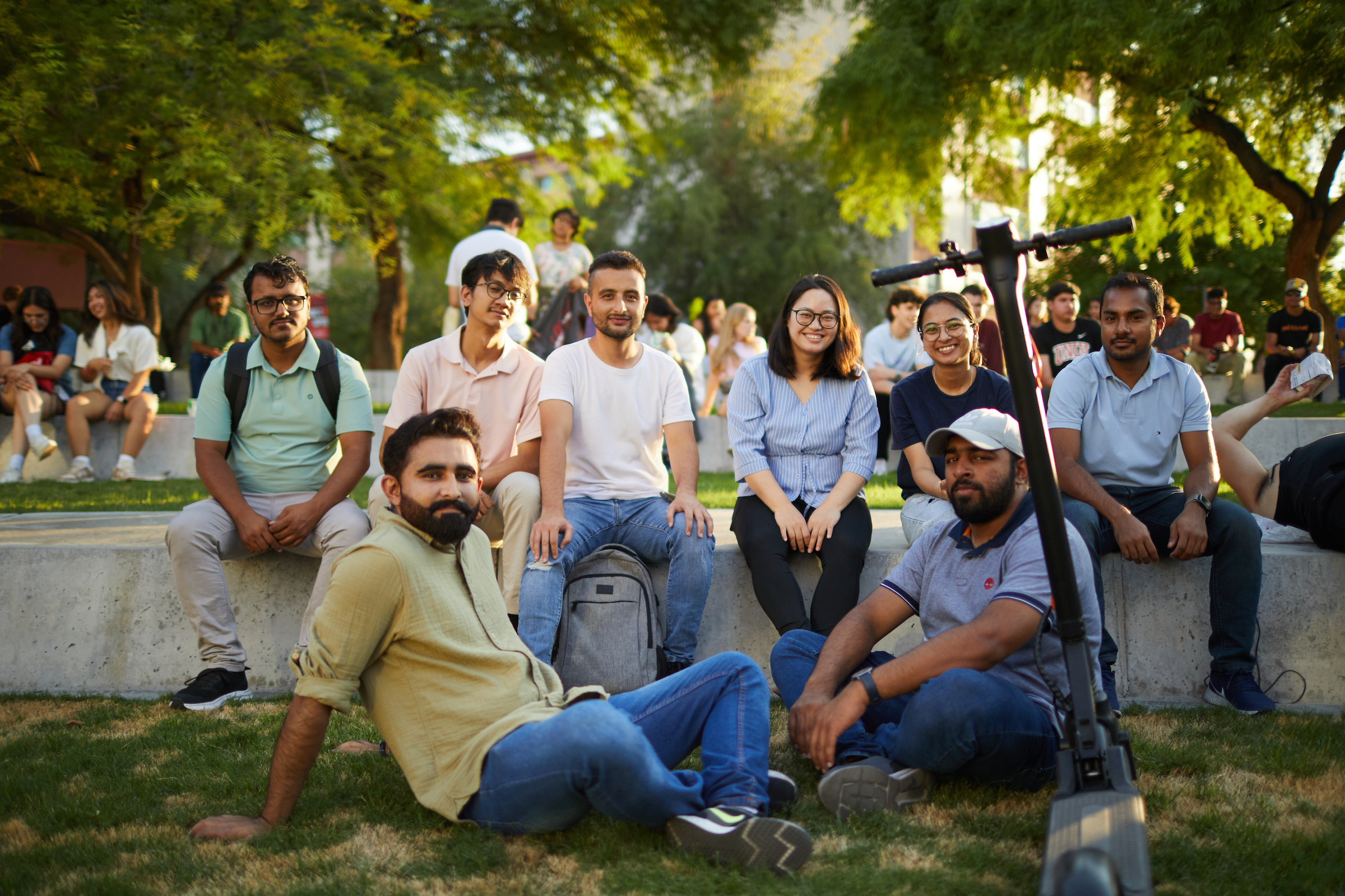 A group of people sitting outdoors