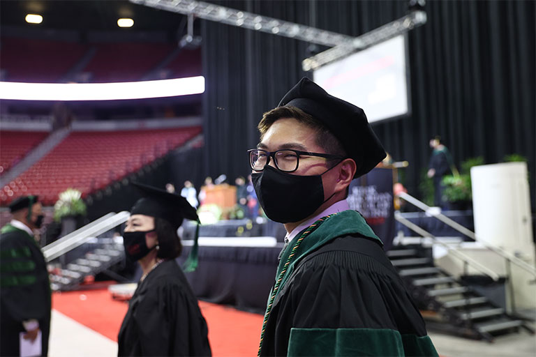 Charter Class graduate student, Toyokazu (Chris) Endo, at the Commencement and Academic Hooding Ceremony