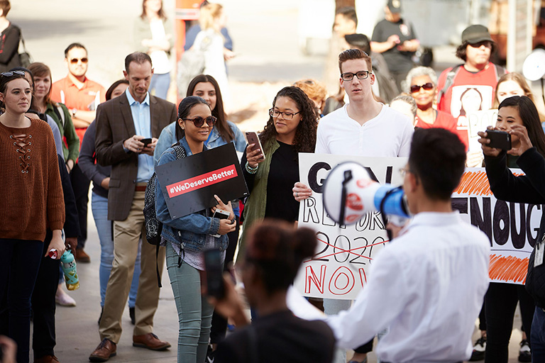 Man addresses a crowd