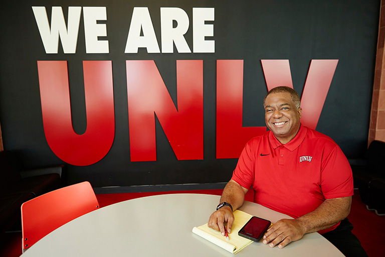 U-N-L-V President Keith Whitfield under We Are U-N-L-V sign