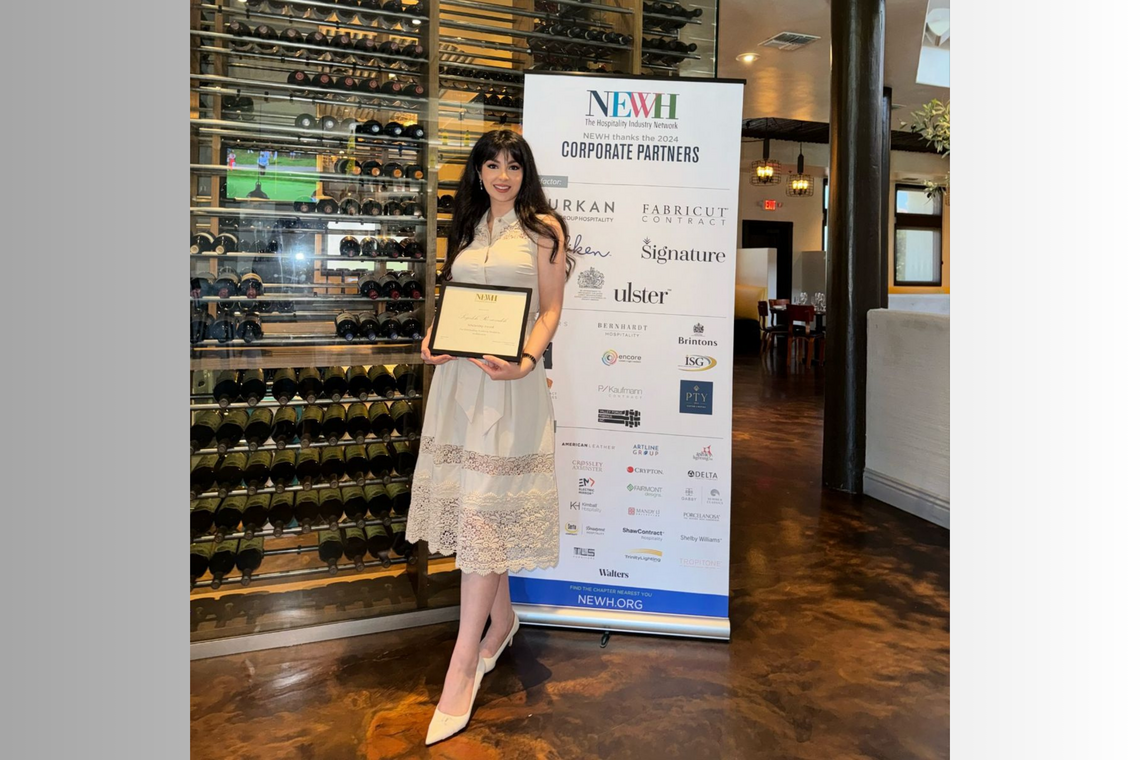 Mona Rezazadeh posing with her award certificate