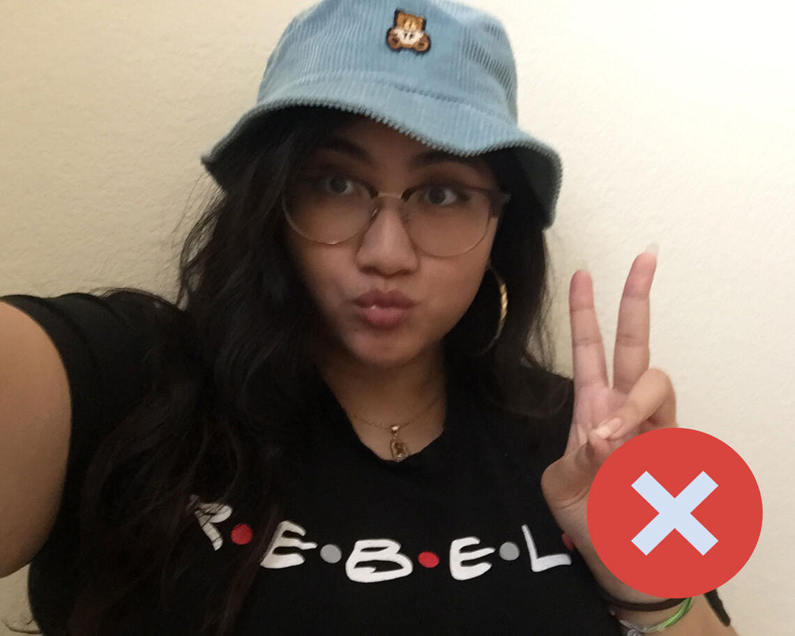 Photo of woman posing with a peace sign