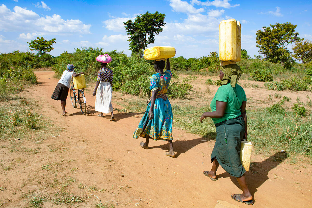 african woman carrying water        
        <figure class=