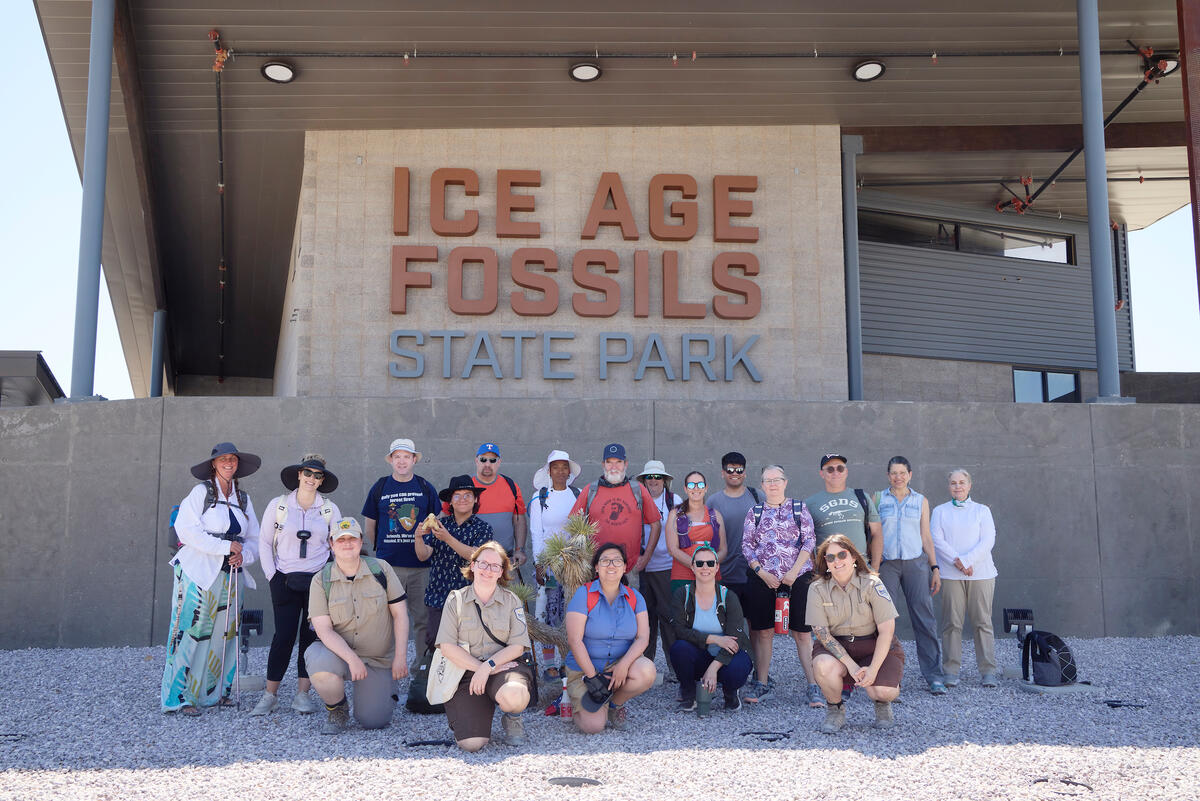 group posing in front of sign that reads Ice Age Fossils State Park
