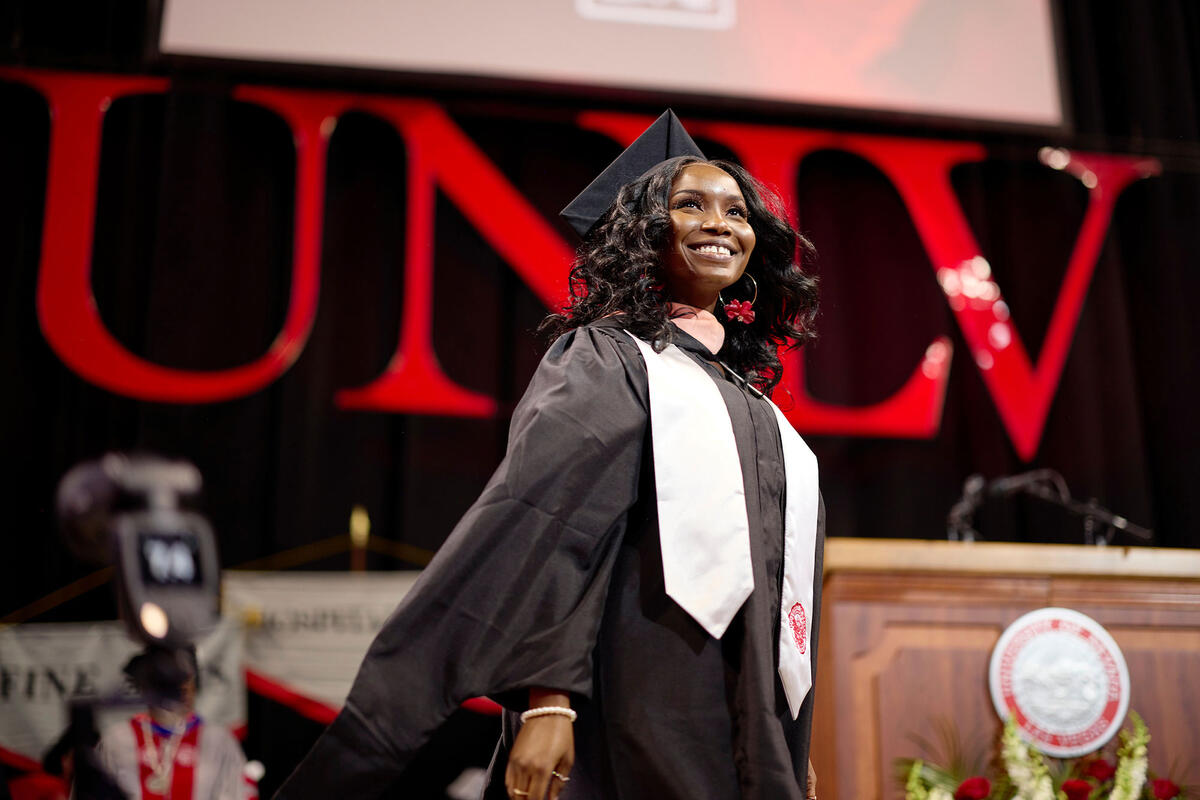 A graduate on stage during the ceremony