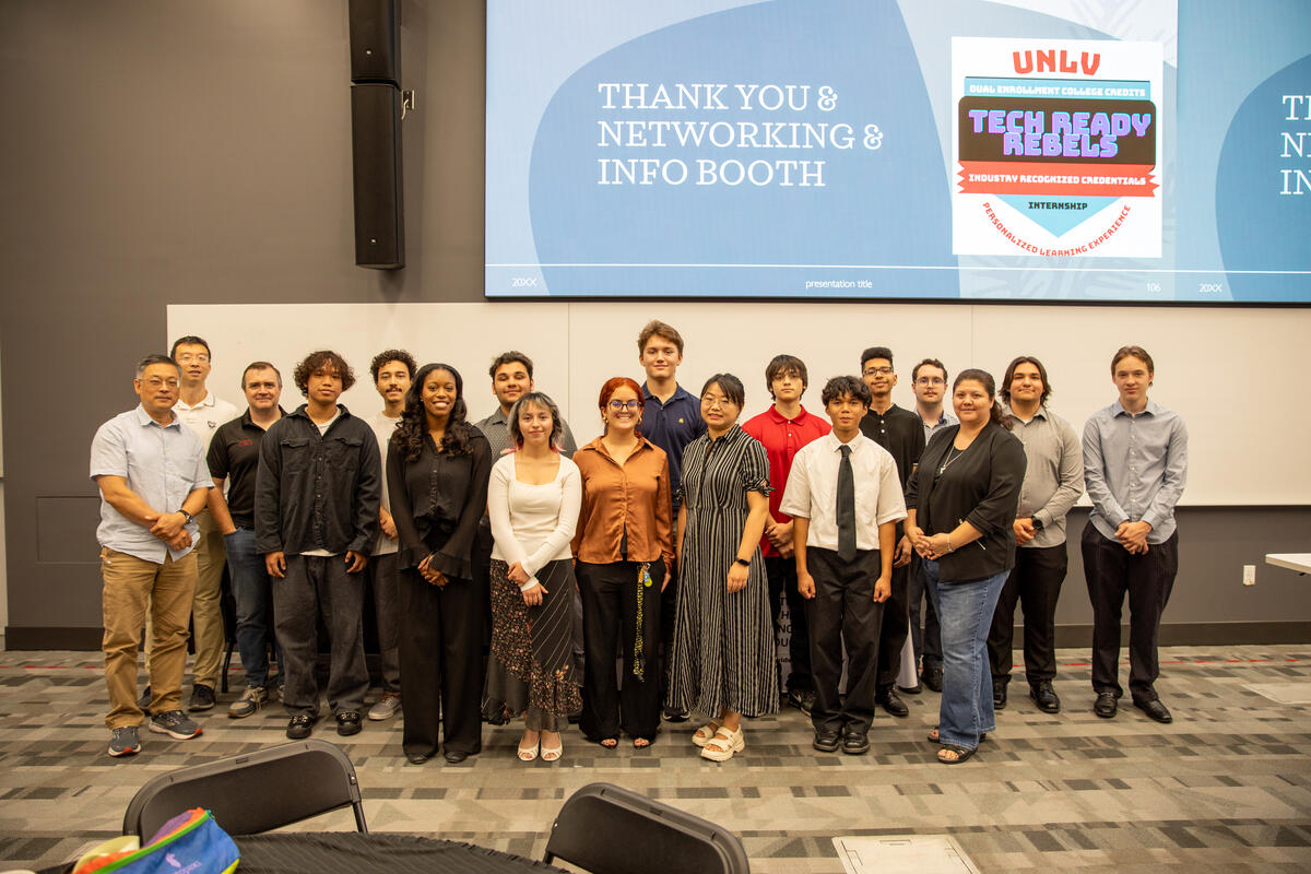 group of young students pose during conference