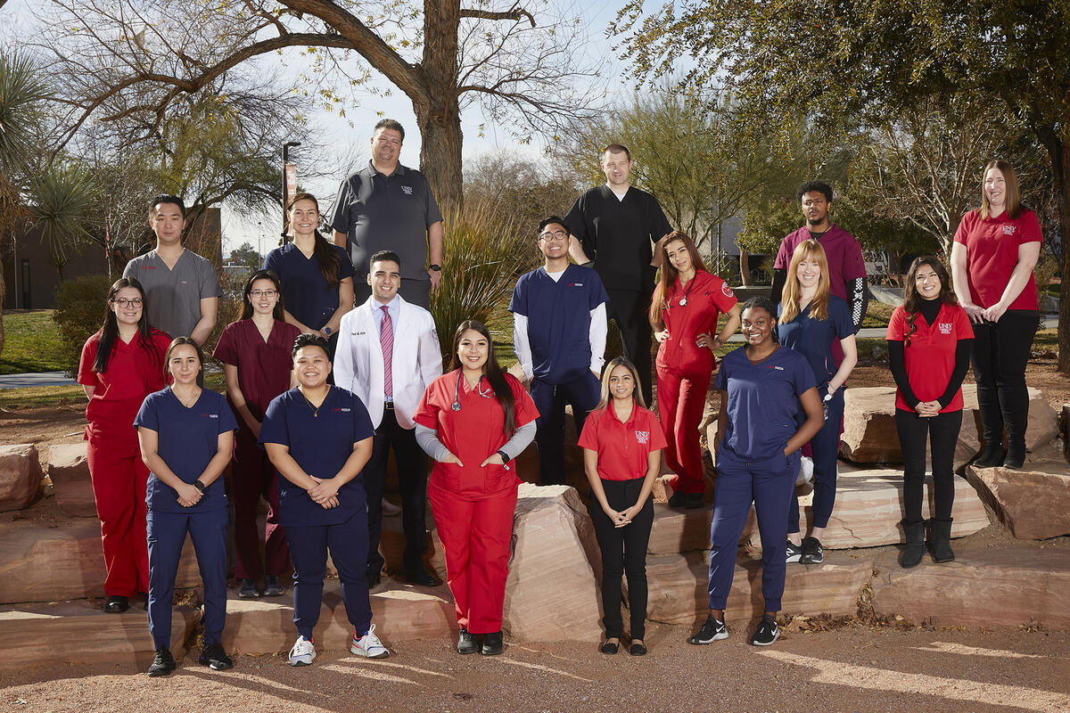 group of health sciences staff and students stand outside