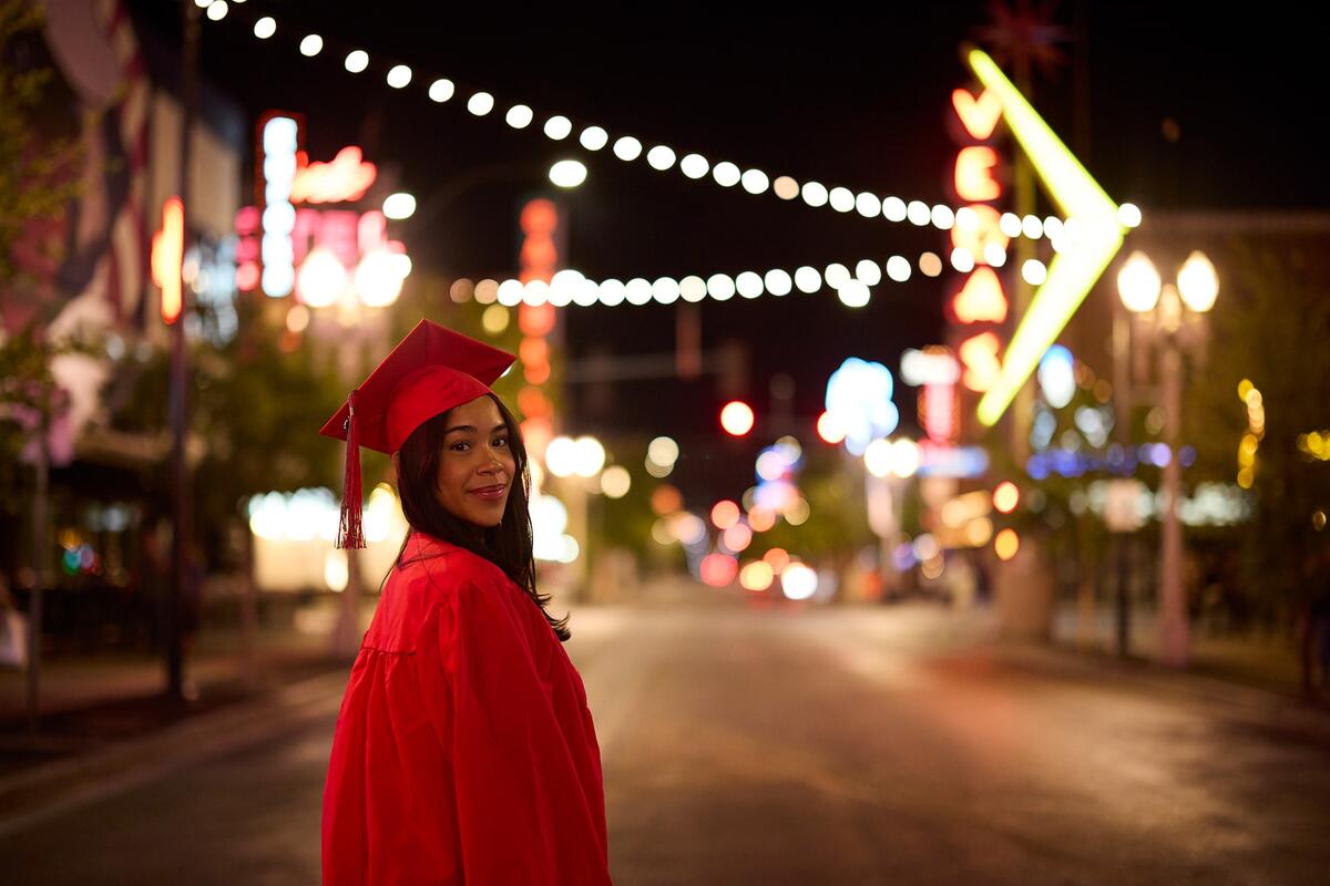 Student in cap and gown in Downtown Las Vegas