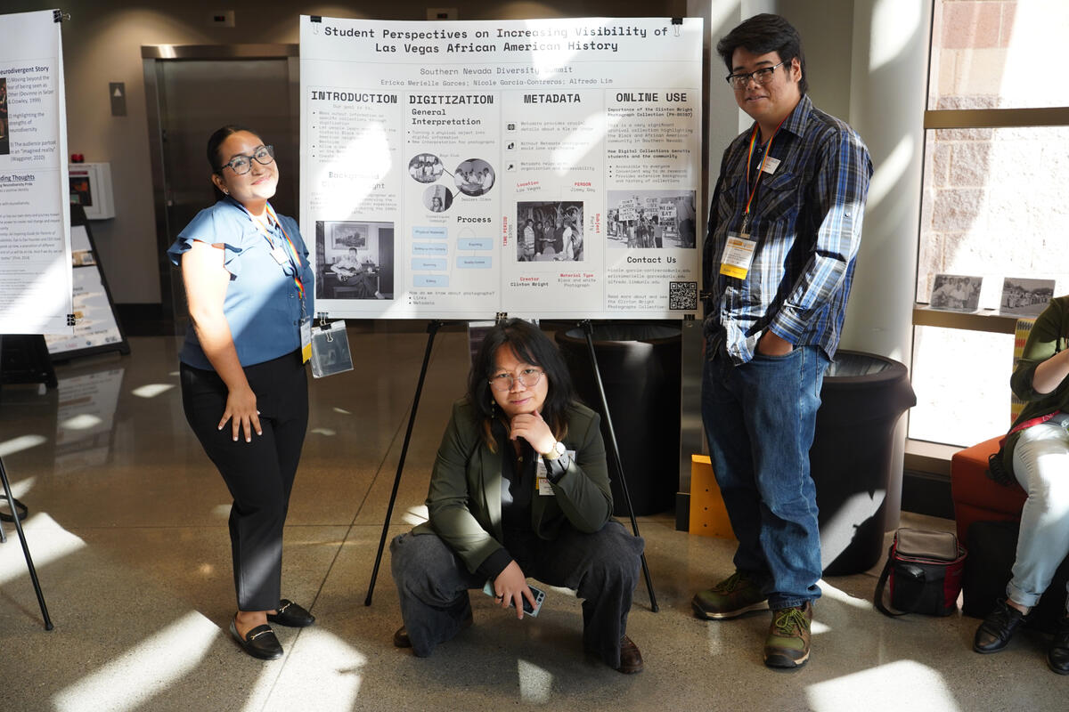 Nicole Garcia-Contreras, Ericka Merielle Garces, and Alfredo Lim present a research poster.