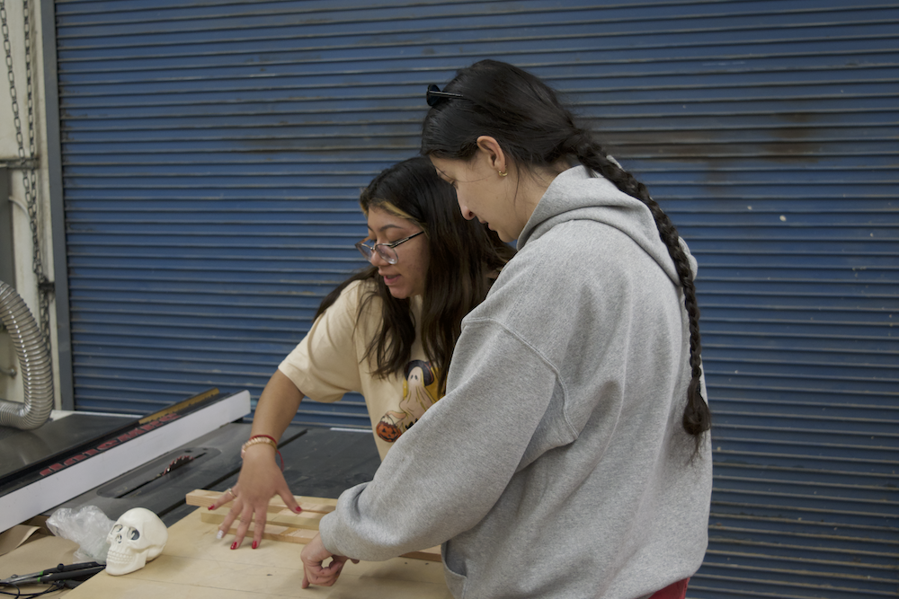 two students working with wood