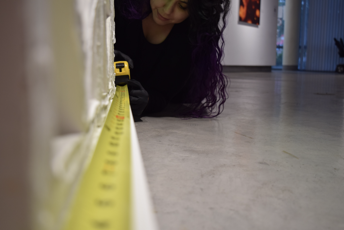 student with tape measure