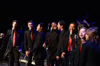 Jazz vocalists perform in this promotional photo.