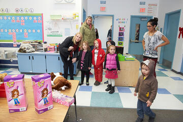Young children from the UNLV Preschool, which is located next door to the elementary school, also helped deliver the toys to a Paradise Elementary School Kindergarten classroom.