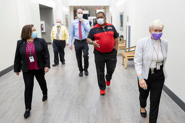 UNLV President Keith E. Whitfield touring the School of Dental Medicine with four other UNLV administrators