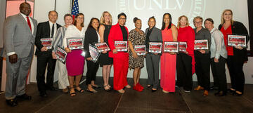 1991 UNLV softball team players lined up on stage