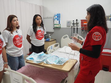 Nursing student teaches students about oxygenation techniques