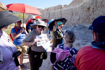 a park ranger speaks with visitors at Ice Age Fossils Park in Nevada