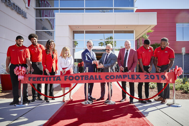 People preparing to cut ribbon on new Fertitta Complex