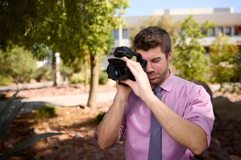 man using a camcorder