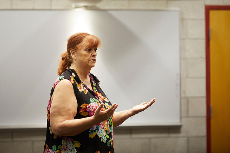 Erin Breen speaks at front of room during traffic safety workshop