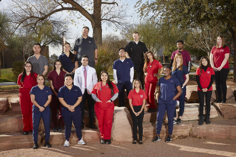 group of health sciences staff and students stand outside