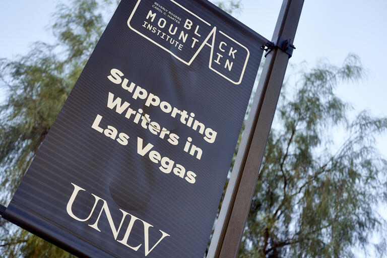 flag that reads &quot;black mountain institute&quot; and &quot;supporting writers in Las Vegas&quot;