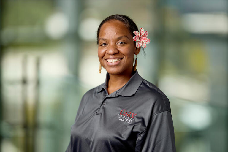 cropped portrait of woman wearing blouse and flower in her hair