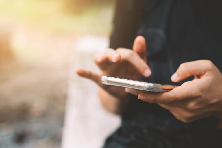 closeup of person holding phone