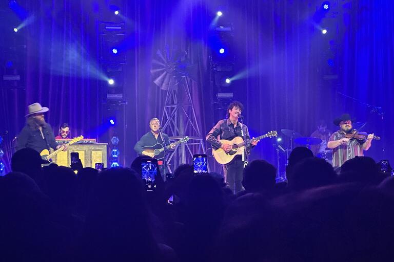 Flatland Country band members on the stage at Brooklyn Bowl Las Vegas on Saturday, October 5, 2024. Lead singer Cleto Cordero, drummer Jason Albers, bassist Jonathan Saenz, fiddler Wesley Hall, and guitarist Reid Dillon.