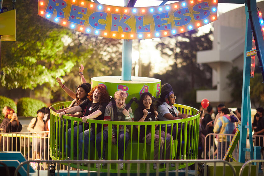 Students on a ride at the homecoming festival