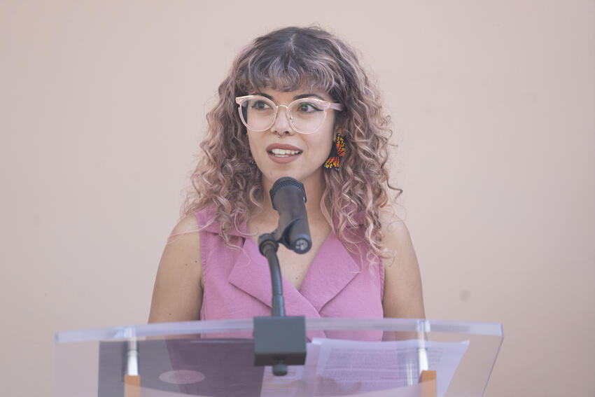 Marcela Rodriguez-Campo speaking at a podium