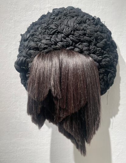 Clarice Tara Cuda. Cut, 2023. Human Hair, Canvas, Spray Paint, Chicken Wire.  22” x 28” x 10”